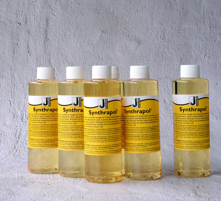 Five bottles of Synthrapol textile detergent for poly dyeing auxiliaries